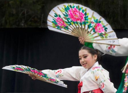 Korean American Youth Performing Artists mix colorful fans and clothing with graceful dance during the Korean Cultural Festival at Irvine City Hall on Sunday. ///ADDITIONAL INFO: - Photo by MINDY SCHAUER, THE ORANGE COUNTY REGISTER - shot: 051416 i.0514.koreanfestival Thousands attend the seventh annual Irvine Korean Cultural Festival, which commemorates Korean immigration to the United States since Jan. 13, 1903.